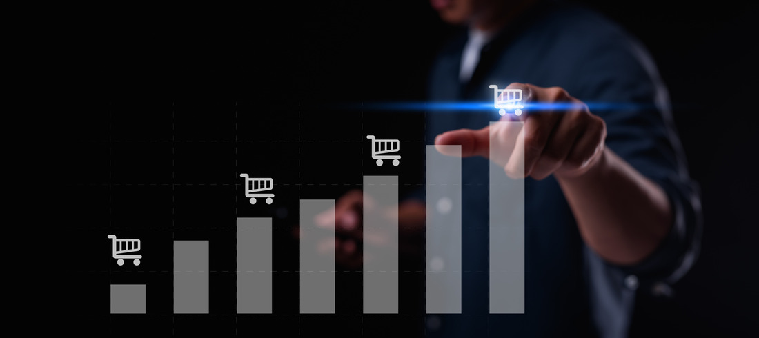 Businessman analyzing ecommerce sales growth on digital interface, indicating business success with ecommerce platform ROI